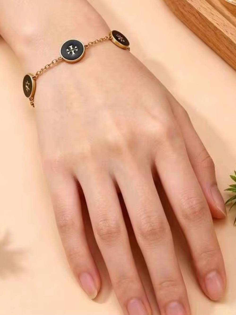 Gold Bracelet with Black Enamel Medallions